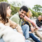 Diverse group of young people laughing and having fun together